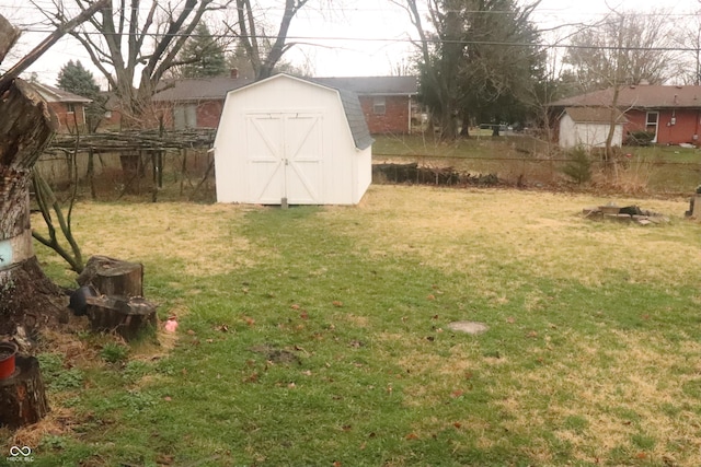 8137 S Delaware St, Indianapolis, IN 46227 - view of yard with a storage unit, an outbuilding, and fence
