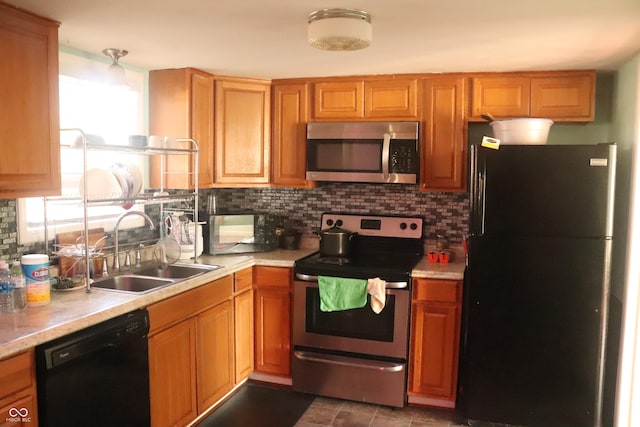 8137 S Delaware St, Indianapolis, IN 46227 - kitchen featuring decorative backsplash, black appliances, light countertops, and a sink