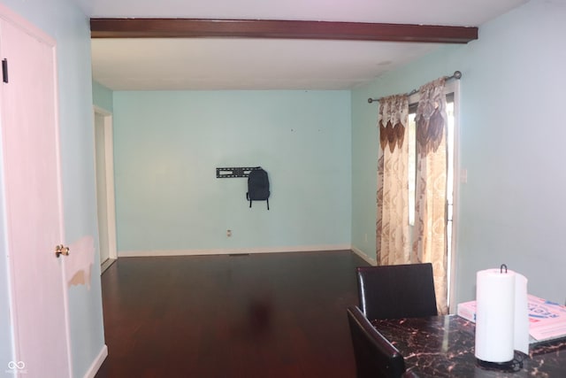 8137 S Delaware St, Indianapolis, IN 46227 - dining space with baseboards, beam ceiling, and wood finished floors
