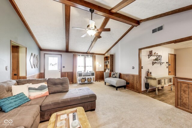 7152 Sandalwood Dr, Avon, IN 46123 - living room featuring wainscoting, visible vents, carpet floors, and a textured ceiling