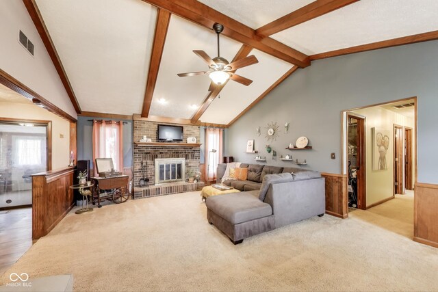 7152 Sandalwood Dr, Avon, IN 46123 - living room featuring a ceiling fan, lofted ceiling with beams, a brick fireplace, visible vents, and carpet
