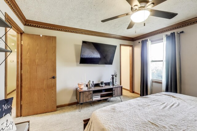 7152 Sandalwood Dr, Avon, IN 46123 - bedroom with crown molding, a ceiling fan, a textured ceiling, baseboards, and light colored carpet