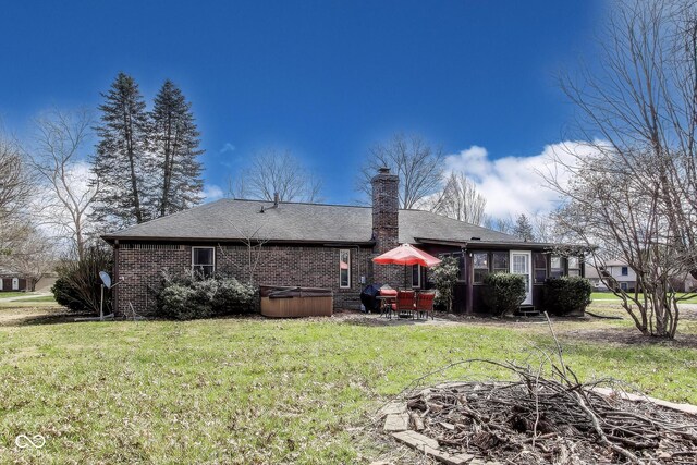7152 Sandalwood Dr, Avon, IN 46123 - back of property with roof with shingles, brick siding, a yard, and a chimney