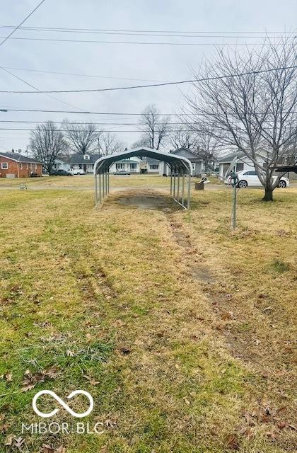 view of yard with a detached carport