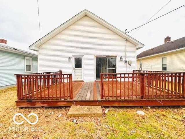 back of house featuring a wooden deck