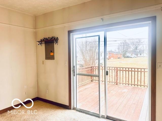 entryway with baseboards, plenty of natural light, and electric panel