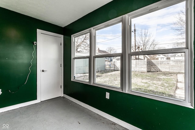 3732 N Kenwood Ave, Indianapolis, IN 46208 - unfurnished room with baseboards and concrete floors