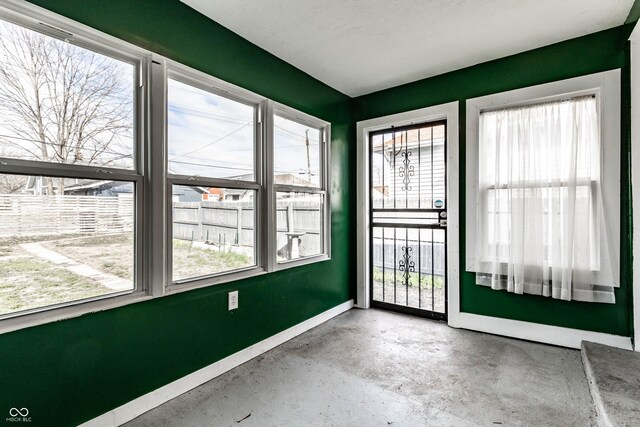 3732 N Kenwood Ave, Indianapolis, IN 46208 - empty room with plenty of natural light and concrete flooring