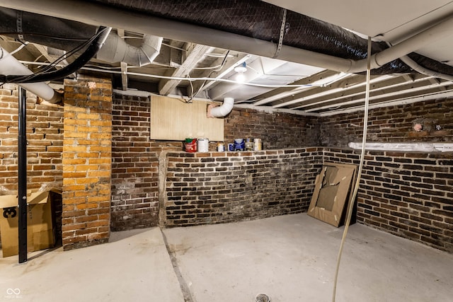 3732 N Kenwood Ave, Indianapolis, IN 46208 - unfinished basement with brick wall