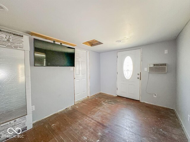 foyer featuring a wall mounted air conditioner and wood-type flooring
