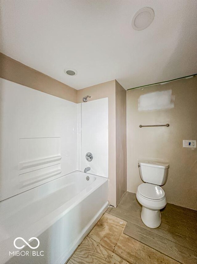 bathroom with toilet and shower / tub combination