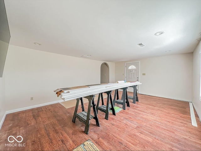 dining room featuring baseboards, visible vents, and light wood finished floors