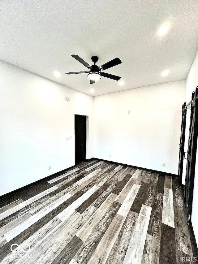 511 N Clark St, Lebanon, IN 46052 - spare room featuring dark wood-style floors, baseboards, and ceiling fan