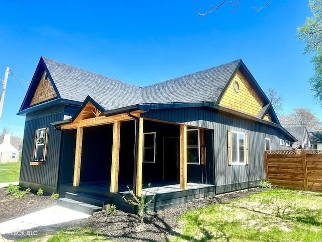 511 N Clark St, Lebanon, IN 46052 - exterior space with fence, a porch, and a shingled roof