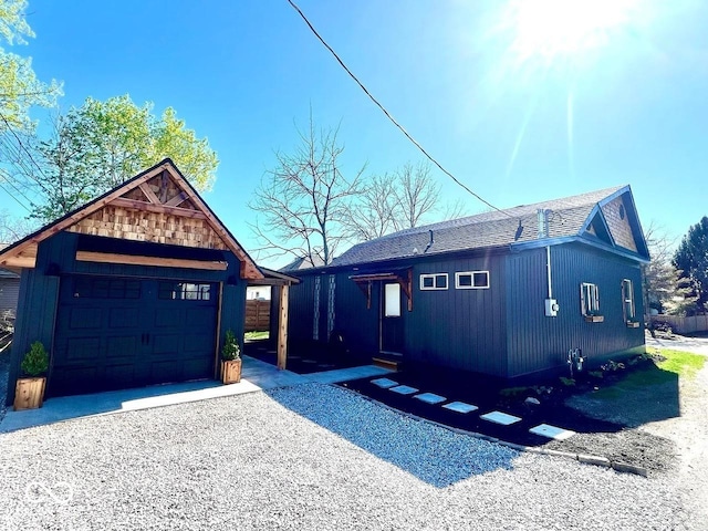 511 N Clark St, Lebanon, IN 46052 - view of front facade with a detached garage, an outdoor structure, and driveway