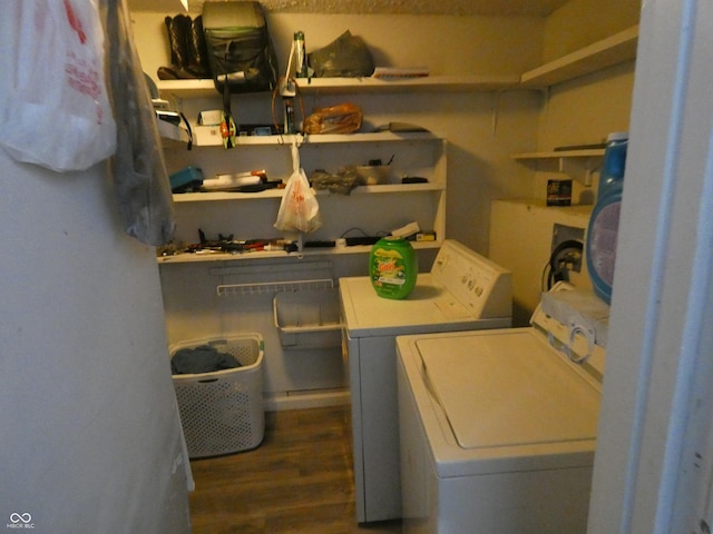 washroom with laundry area, wood finished floors, and separate washer and dryer