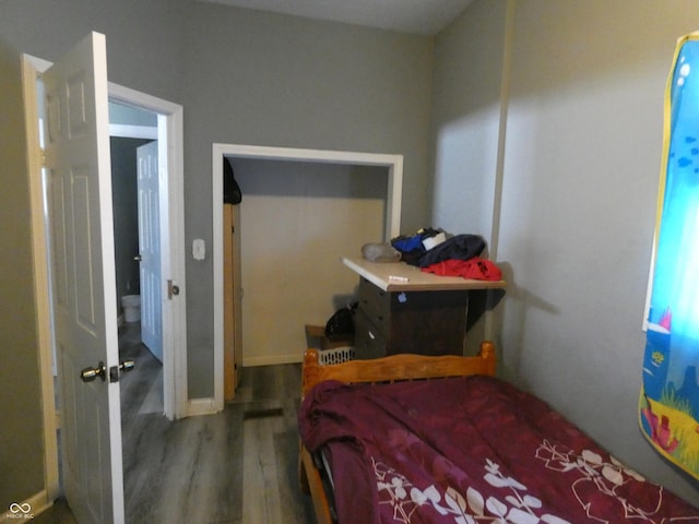 bedroom featuring wood finished floors