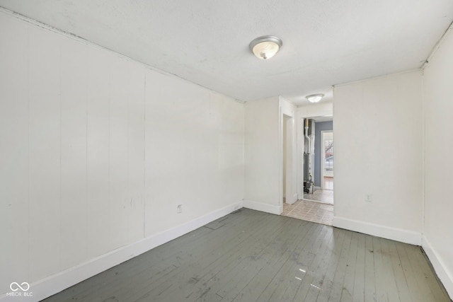 1039 S Ohio St, Martinsville, IN 46151 - empty room with baseboards and wood-type flooring