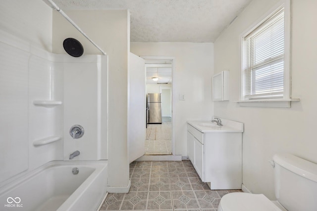1039 S Ohio St, Martinsville, IN 46151 - bathroom with vanity, bathtub / shower combination, tile patterned flooring, a textured ceiling, and toilet