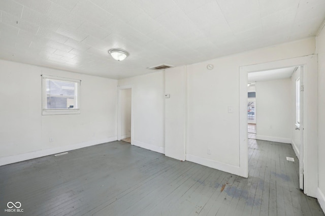 1039 S Ohio St, Martinsville, IN 46151 - unfurnished room featuring visible vents, baseboards, and hardwood / wood-style flooring