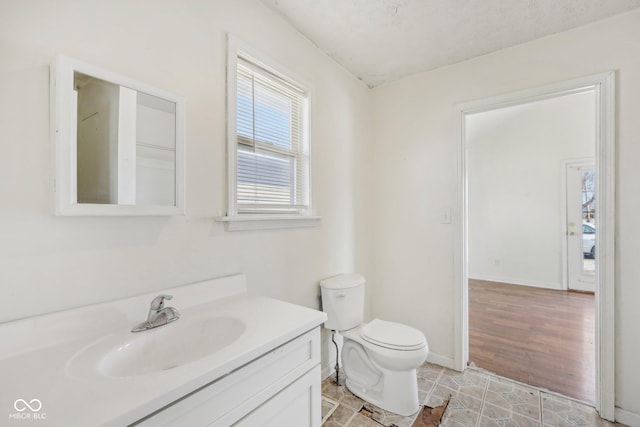1039 S Ohio St, Martinsville, IN 46151 - bathroom featuring baseboards, toilet, and vanity