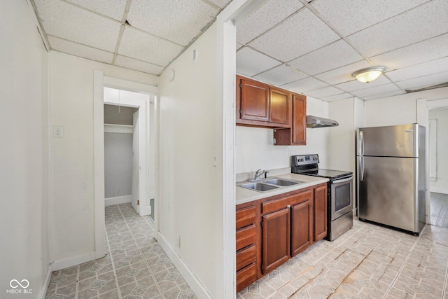 1039 S Ohio St, Martinsville, IN 46151 - kitchen with a drop ceiling, light countertops, exhaust hood, stainless steel appliances, and a sink