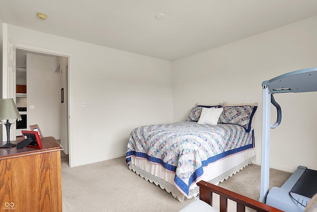 bedroom featuring baseboards and carpet flooring