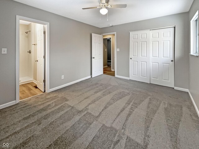 unfurnished bedroom with a ceiling fan, connected bathroom, carpet floors, a closet, and baseboards