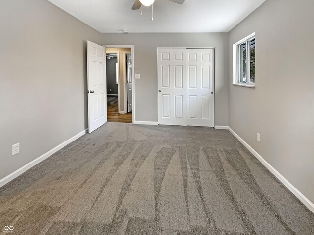 unfurnished bedroom featuring a ceiling fan, baseboards, carpet floors, and a closet