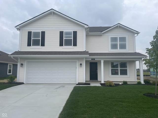 1265 Fleming Dr, Greenfield, IN 46140 - view of front of house featuring a porch, a front lawn, concrete driveway, a garage, and a shingled roof