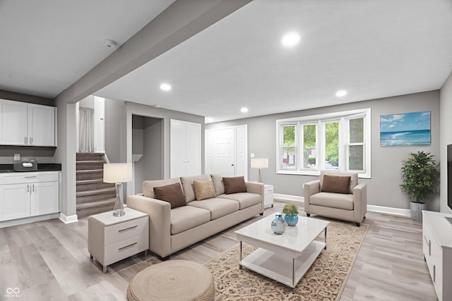 1641 Whistler Ter, Indianapolis, IN 46229 - living room featuring baseboards, recessed lighting, light wood-style floors, and stairs