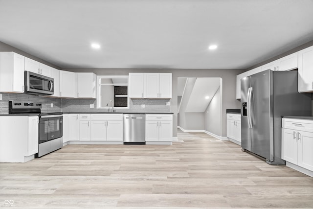 1641 Whistler Ter, Indianapolis, IN 46229 - kitchen with appliances with stainless steel finishes, recessed lighting, decorative backsplash, a sink, and white cabinetry