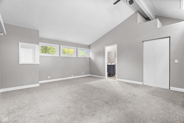 1641 Whistler Ter, Indianapolis, IN 46229 - unfurnished bedroom featuring beamed ceiling, carpet, baseboards, connected bathroom, and high vaulted ceiling