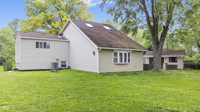 1641 Whistler Ter, Indianapolis, IN 46229 - rear view of property with central air condition unit and a shingled roof
