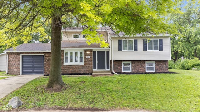 1641 Whistler Ter, Indianapolis, IN 46229 - split level home with a garage, a front lawn, brick siding, and driveway