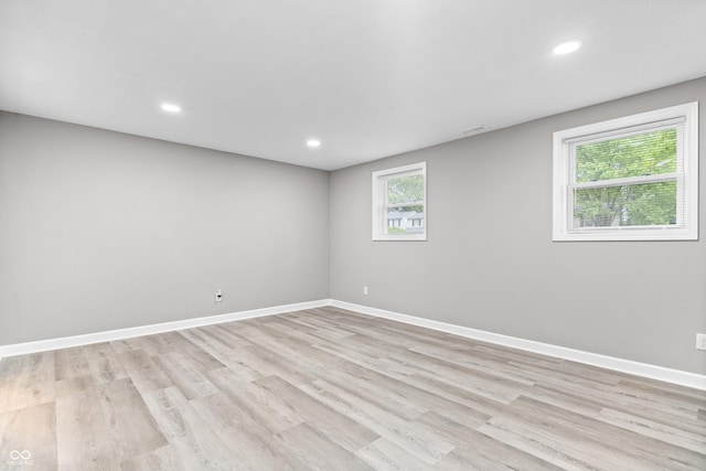 1641 Whistler Ter, Indianapolis, IN 46229 - unfurnished room with baseboards, light wood-type flooring, and recessed lighting