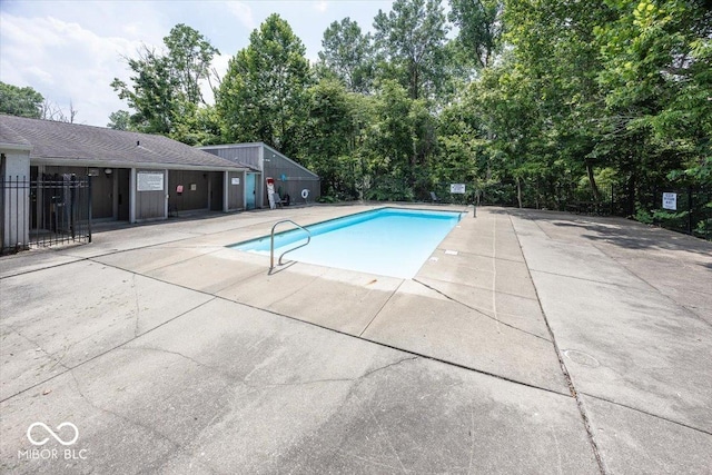 7965 Benjamin Dr, Lawrence, IN 46226 - community pool featuring a patio area and view of scattered trees