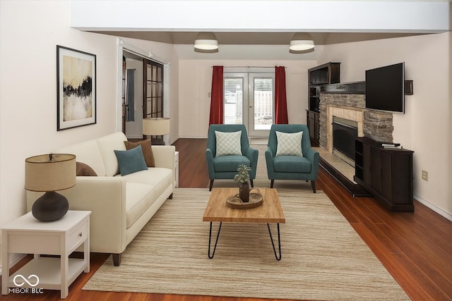 7965 Benjamin Dr, Lawrence, IN 46226 - living area with dark wood-style flooring and a stone fireplace