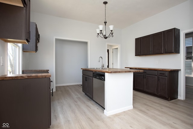 249 N Hamilton Ave, Indianapolis, IN 46201 - kitchen featuring stainless steel dishwasher, light wood-style flooring, a sink, wood counters, and a notable chandelier