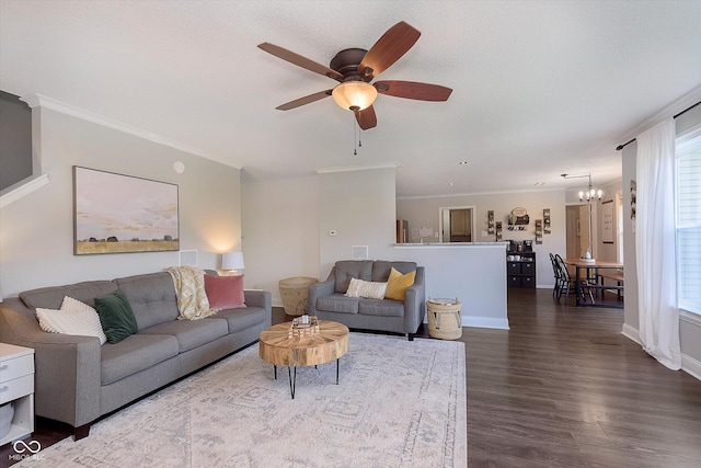 9011 Harrison Run Dr, Indianapolis, IN 46256 - living area featuring ceiling fan, a chandelier, dark wood-type flooring, crown molding, and baseboards