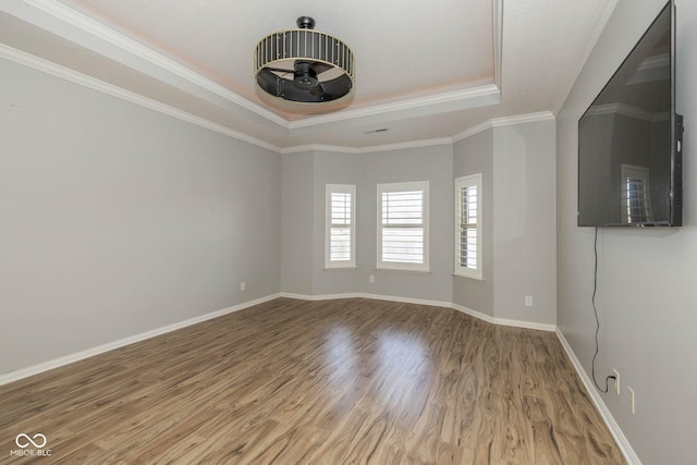 3792 Waterfront Way, Plainfield, IN 46168 - unfurnished room featuring baseboards, crown molding, a tray ceiling, and wood finished floors
