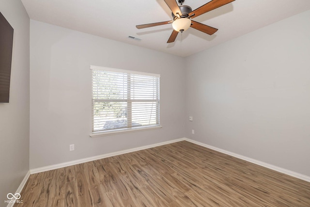 3792 Waterfront Way, Plainfield, IN 46168 - empty room with a ceiling fan, wood finished floors, visible vents, and baseboards