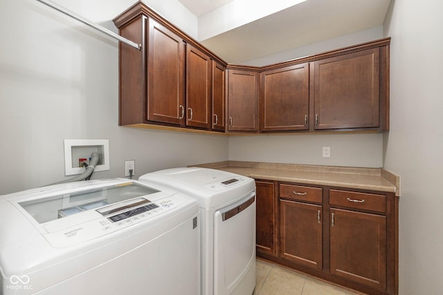 3792 Waterfront Way, Plainfield, IN 46168 - washroom with separate washer and dryer, light tile patterned flooring, and cabinet space