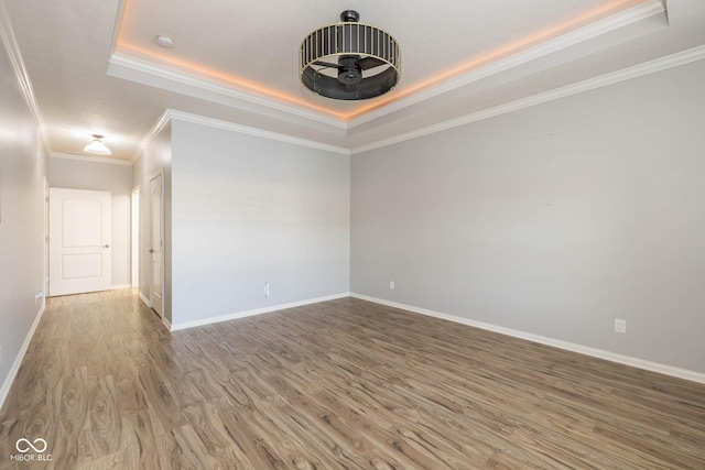 3792 Waterfront Way, Plainfield, IN 46168 - unfurnished room with a tray ceiling, wood finished floors, baseboards, and ornamental molding