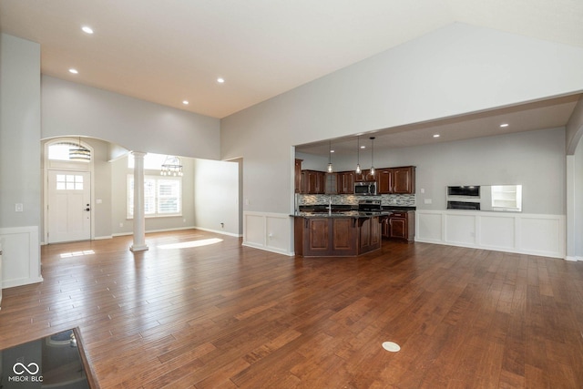 3792 Waterfront Way, Plainfield, IN 46168 - unfurnished living room featuring recessed lighting, decorative columns, arched walkways, and dark wood-style flooring