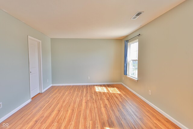 5944 Edelle Dr, Indianapolis, IN 46237 - empty room featuring visible vents, baseboards, and light wood-type flooring