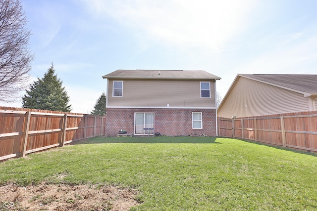 5944 Edelle Dr, Indianapolis, IN 46237 - rear view of property with brick siding, a fenced backyard, and a yard