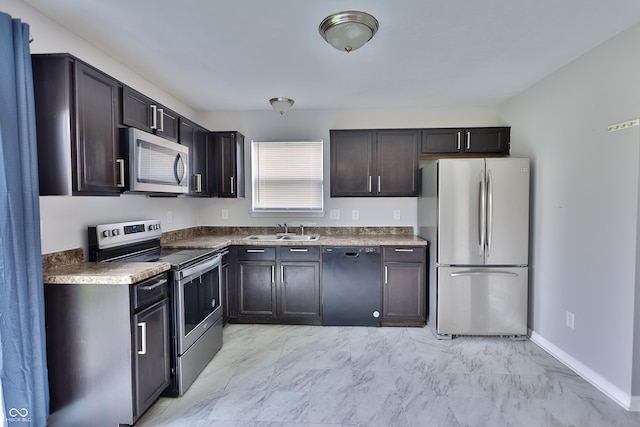 5944 Edelle Dr, Indianapolis, IN 46237 - kitchen with marble finish floor, a sink, appliances with stainless steel finishes, baseboards, and dark brown cabinets