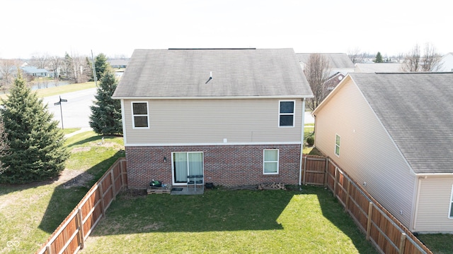 5944 Edelle Dr, Indianapolis, IN 46237 - back of house with brick siding, a lawn, and a fenced backyard