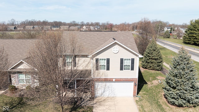 5944 Edelle Dr, Indianapolis, IN 46237 - view of front of house with brick siding, concrete driveway, and an attached garage